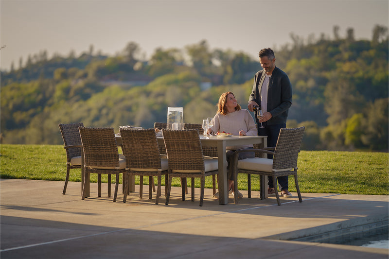 Man and woman sitting at outdoor dining table from SunVilla Home